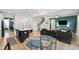 Open-concept living space featuring a kitchen island, dining area, and comfortable seating at 303 Forestview Crest Way, Fuquay Varina, NC 27526