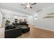 Spacious living area featuring a kitchen, comfortable seating, and a view of the staircase at 303 Forestview Crest Way, Fuquay Varina, NC 27526