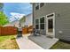 Outdoor patio area featuring a grill, a table, and chairs for perfect outdoor dining and relaxation at 303 Forestview Crest Way, Fuquay Varina, NC 27526