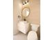 Modern bathroom features a round mirror, vessel sink, and sleek fixtures at 305 W Waddell St, Selma, NC 27576