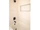 The bathroom features a tub with marble-look tiling and black fixtures at 305 W Waddell St, Selma, NC 27576