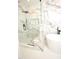 Elegant bathroom featuring a glass shower and soaking tub with marble tile at 305 W Waddell St, Selma, NC 27576
