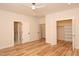 This bedroom features wood-look flooring and access to a closet and bathroom at 305 W Waddell St, Selma, NC 27576