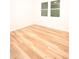 This bedroom features wood-look flooring and a double-hung window at 305 W Waddell St, Selma, NC 27576
