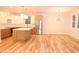 Spacious kitchen with stainless steel refrigerator and stylish lighting fixtures at 305 W Waddell St, Selma, NC 27576