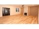 Open living space with a sleek fireplace and hardwood flooring at 305 W Waddell St, Selma, NC 27576