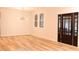 Bright and airy living room featuring hardwood floors and contemporary lighting fixture at 305 W Waddell St, Selma, NC 27576