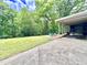 Beautiful backyard with a spacious patio and lush green landscaping offers a private outdoor oasis at 307 Clayton Rd, Chapel Hill, NC 27514
