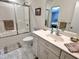 Clean, white full bathroom features a shower with glass door, modern vanity, and ample storage space at 307 Clayton Rd, Chapel Hill, NC 27514