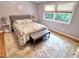 Bright bedroom with large windows, a comfortable bed, and hardwood floors creates a cozy retreat at 307 Clayton Rd, Chapel Hill, NC 27514
