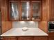 Kitchen features white subway tile backsplash, a quartz countertop, and custom wood cabinets at 307 Clayton Rd, Chapel Hill, NC 27514