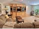 Cozy living room with built-in media center, plush sofa, and comfortable rocking chair at 307 Clayton Rd, Chapel Hill, NC 27514