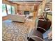Spacious living room with brick fireplace, hardwood floors, and stylish furnishings at 307 Clayton Rd, Chapel Hill, NC 27514