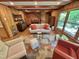 Bright living room with wood paneling, a decorative rug, and comfortable seating at 307 Clayton Rd, Chapel Hill, NC 27514