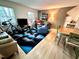 Cozy living room with lots of natural light and hardwood floors at 307 Clayton Rd, Chapel Hill, NC 27514