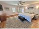 Bright main bedroom featuring hardwood floors, ceiling fan, ensuite and neutral paint at 307 Clayton Rd, Chapel Hill, NC 27514
