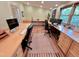 Spacious office space with light wood floors and built-in cabinets offers a bright and functional work area at 307 Clayton Rd, Chapel Hill, NC 27514