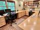 Lovely office with natural light, custom built-ins, and hardwood floors is ideal for working from home at 307 Clayton Rd, Chapel Hill, NC 27514