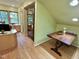 Office space featuring wooden desk, drawers, and shelving near large window at 307 Clayton Rd, Chapel Hill, NC 27514