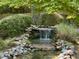 Landscaped waterfall feature adds charm to the outdoor space at 307 Clayton Rd, Chapel Hill, NC 27514