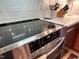 Close-up of a modern induction cooktop with sleek design and user-friendly controls in a well-lit kitchen at 307 Clayton Rd, Chapel Hill, NC 27514
