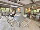 Relaxing sun room showcasing a comfortable seating area and an adjacent dining space at 307 Clayton Rd, Chapel Hill, NC 27514