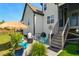 Back patio area with outdoor seating, fire pit, and stairs to a screened-in porch at 324 Prides Xing, Rolesville, NC 27571