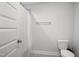 Simple bathroom with shower, gray tile flooring, and white fixtures at 324 Prides Xing, Rolesville, NC 27571
