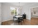 Dining room with views of the outside, complete with modern light fixture and decor at 324 Prides Xing, Rolesville, NC 27571