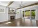 Bright living room featuring a fireplace, access to a balcony and beautiful wooden beams at 324 Prides Xing, Rolesville, NC 27571
