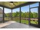 Enclosed porch provides a relaxing view of the lush, green yard at 324 Prides Xing, Rolesville, NC 27571