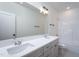 Bathroom featuring a double sink vanity, large mirror, modern fixtures, and shower-tub combo at 3258 Yorkshire Cir, Sanford, NC 27332