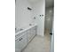 Elegant bathroom with double vanity sinks, modern fixtures, and a walk-in tiled shower at 3258 Yorkshire Cir, Sanford, NC 27332