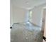 Bright bedroom with neutral walls and flooring, natural light from window, and a modern door at 3258 Yorkshire Cir, Sanford, NC 27332