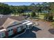 Beautiful clubhouse with golf cart parking and scenic views of the course and lake at 3258 Yorkshire Cir, Sanford, NC 27332