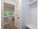 Entryway leading to the kitchen, with coat rack and view of kitchen island at 3258 Yorkshire Cir, Sanford, NC 27332