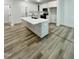 Modern kitchen with a spacious island, white cabinetry, and stainless steel appliances at 3258 Yorkshire Cir, Sanford, NC 27332