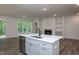 Bright kitchen with an island, stainless steel appliances, and an open-concept floor plan at 3258 Yorkshire Cir, Sanford, NC 27332