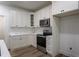 Modern kitchen with white cabinets, stainless steel appliances, subway tile backsplash, and sleek countertops at 3258 Yorkshire Cir, Sanford, NC 27332