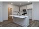 Bright kitchen with an island, stainless steel appliances, and white cabinets and countertop at 3258 Yorkshire Cir, Sanford, NC 27332