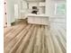 Modern kitchen with a large island, white cabinets, and stainless steel appliances at 3258 Yorkshire Cir, Sanford, NC 27332