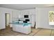 Spacious kitchen boasts white cabinets, new appliances, an island with a sink, and a window view at 3258 Yorkshire Cir, Sanford, NC 27332
