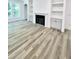 Bright living room featuring a fireplace with built-in shelving and large windows at 3258 Yorkshire Cir, Sanford, NC 27332