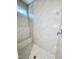 Detailed view of the tiled walk-in shower with a built-in bench and modern fixtures at 3258 Yorkshire Cir, Sanford, NC 27332