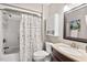 Bathroom featuring a shower-tub combination and vanity with built-in cabinet at 35 Stonewall Way, Durham, NC 27704