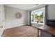 Cozy bedroom with wood-look flooring and large bay window at 35 Stonewall Way, Durham, NC 27704