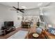 Bright living room with skylights, dining area, and view of the staircase at 35 Stonewall Way, Durham, NC 27704