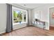 Bright living room featuring wood-look flooring, a large bay window, and natural light at 35 Stonewall Way, Durham, NC 27704