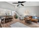 Open concept living room and dining area with access to the kitchen, stairs, and fireplace at 35 Stonewall Way, Durham, NC 27704