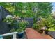 Charming brick patio with mature landscaping and access to garden, a table and chairs at 35 Stonewall Way, Durham, NC 27704